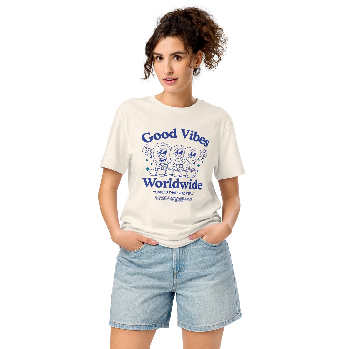 White T-shirt with ‘Good Vibes Worldwide’ text and smiling faces and peace sign graphic.